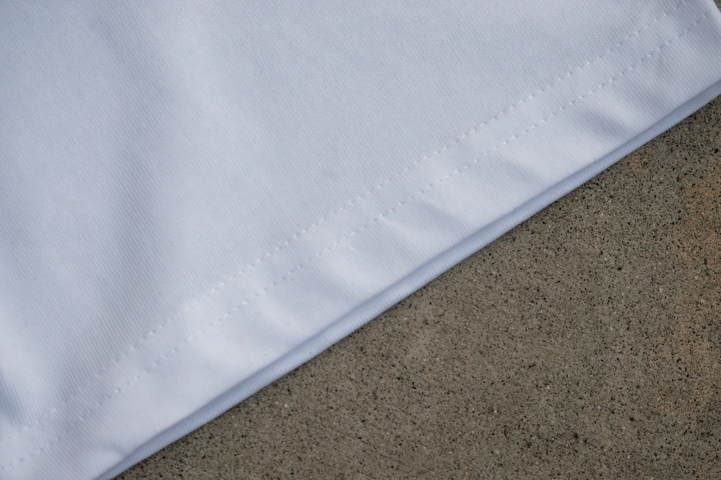 Detailed stitching along the hem of the eco-friendly organic cotton t-shirt, ideal for casual wear or bird-inspired gifts for nature lovers.