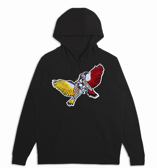 A black Bird Club hoodie displayed against a white background, featuring a striking chenille embroidery of two woodpeckers in vibrant colors—one with yellow and the other with red wings. The detailed embroidery adds a bold and artistic touch, reflecting the brand's dedication to ornithology and sustainable fashion. The hoodie, from a sustainable brand collection, combines eco-friendly materials with a passion for bird watching, appealing to environmentally conscious consumers and bird enthusiasts.